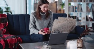 Caucasian Beautiful Young Woman Online Coach Performing Distant Lesson for Students Using Laptop Computer Freelancing from Home Interior.