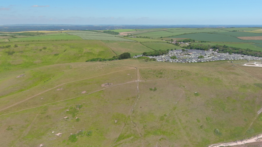 Durdle Door, UK: Aerial view of famous rock formation (limestone arch) on Jurassic Coast - landscape panorama of United Kingdom from above