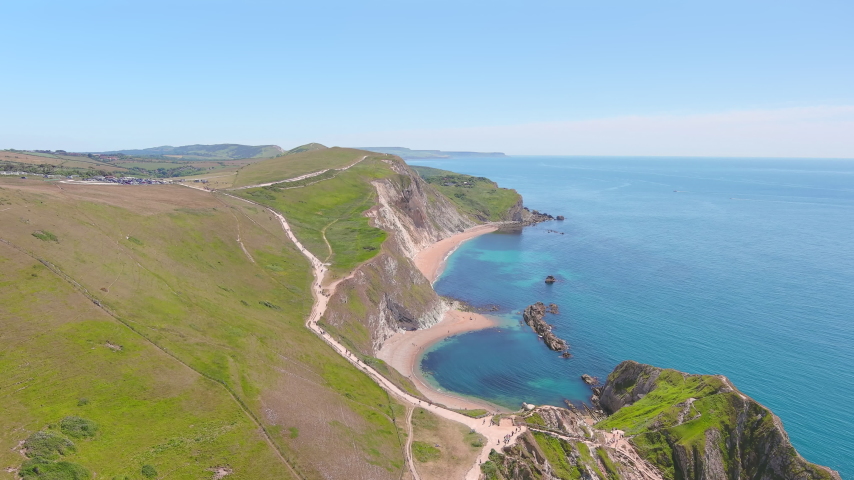Aerial view of white limestone cliffs near Durdle Door on Jurassic Coast - landscape panorama of United Kingdom from above