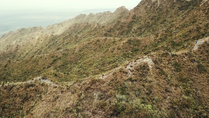 Group of hikers descend the Longonot mountain in Kenya - Aerial High quality 4k footage
