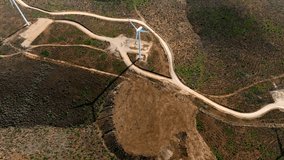 Aerial topdown view of wind turbine spinning generating energy, mountain landscape in northern Chile. - Powered by Shutterstock - Get 15% off with code: PIKWIZARD15