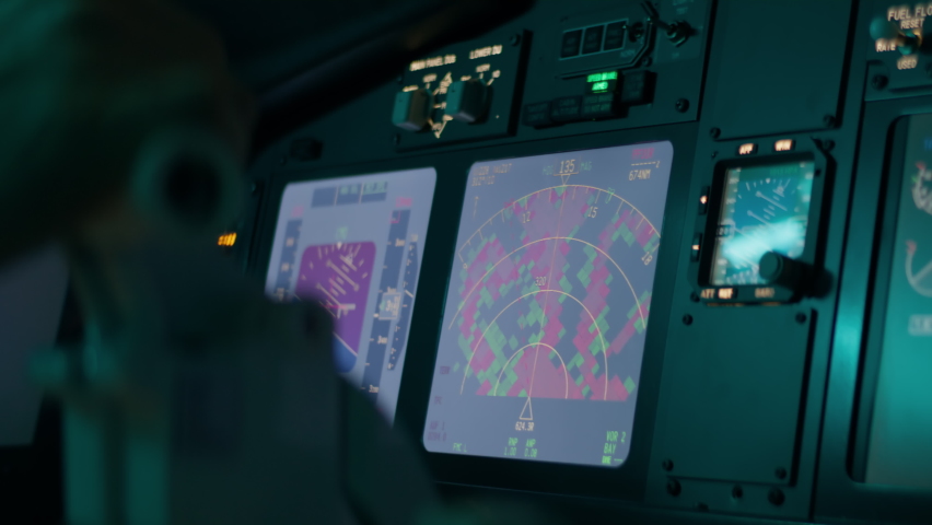 CU on airplane weather radar screen inside the cockpit, aircraft going through thunderstorm rain clouds, heavy turbulence | Shutterstock HD Video #1094534283