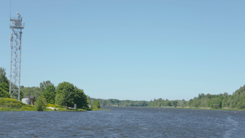The steel tower on the island on the lake on a hot sunny day in Estonia