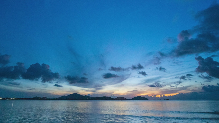Sunrise. Sun up over mountains. sunset sky beach. Time-lapse sea sky. Clouds running past sky. Ocean panorama.   