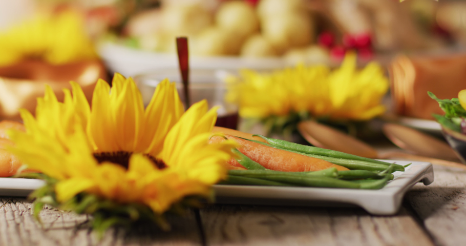 Video of tray with roasted turkey and diverse dishes on wooden surface. Thanksgiving, american culture, tradition and celebration video.
