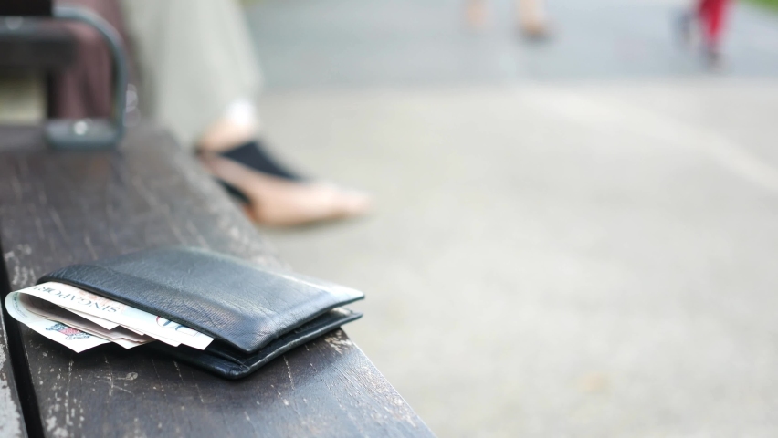  left wallet on a bench in the park 