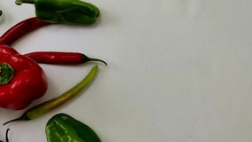 A beautiful 4k video from the top with hot peppers and bell peppers colored in red, green and yellow

