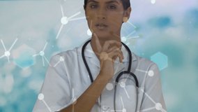 Animation of medical icons and molecules over biracial female doctor. Global medicine, computing, digital interface and data processing concept digitally generated video. - Powered by Shutterstock - Get 15% off with code: PIKWIZARD15