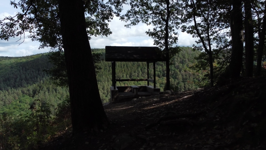 The valley of Ninglinspo, Aerial flying over huge forest through house at viewpoint