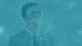 Animation of plexus networks against caucasian businessman talking on phone headset. Global networking and business technology concept - Powered by Shutterstock - Get 15% off with code: PIKWIZARD15