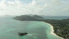 Aerial view of the nature of the Seychelles islands. Coastline with beaches. Indian Ocean. Mountains and jungles in an exotic place. High quality 4k footage