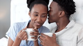 Relax, flirt and a couple with coffee in bed on a weekend morning. Love, romance and a black woman and man happy in the bedroom with a hot drink. lovers, friends and partners, a healthy relationship. - Powered by Shutterstock - Get 15% off with code: PIKWIZARD15