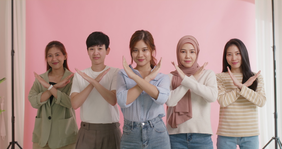 Diverse group of asia Gen z girl arm cross break the bias happy face look at camera in model shooting studio shot. Power of woman's day right or gay youth LGBT pride unity team strong cool proud smile | Shutterstock HD Video #1094572595