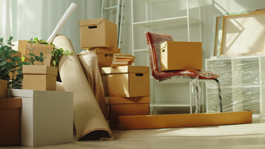 Moving to new house. Real estate, buying flat apartment. Young man carrying boxes, guy owner during relocation. Property purchasing. Housing service concept. Royalty-Free Stock Footage #1094576077
