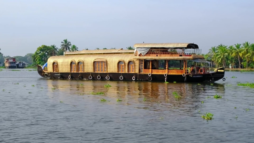 Traditional houseboat at beautiful backwaters in Alleppey, Kerala state, India | Shutterstock HD Video #1094592731
