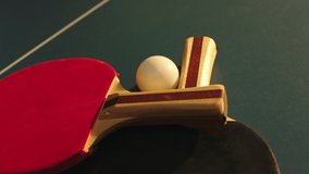 Taking video details closeup of a two paddles and ball over the table tennis concept of sport and healthy lifestyle