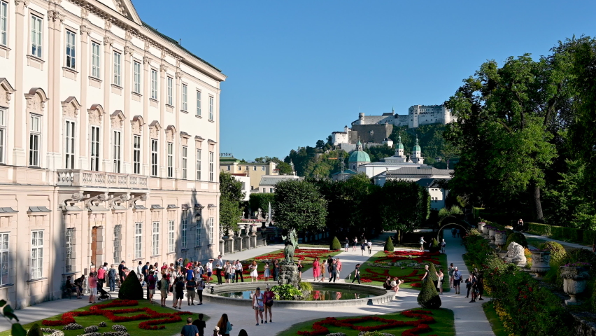 Salzburg, Austria, August 2022. Enchanting daytime footage of the Mirabell Palace Gardens. The in highlights the Hohensalzburg fort in the background.