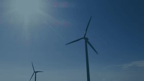 Animation of data processing over wind turbine and sky with clouds. Global technology and data processing concept digitally generated video.