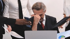 The head of the business executive had a serious expression on his face as the employees presented him with various problems. - Powered by Shutterstock - Get 15% off with code: PIKWIZARD15