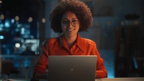 Beautiful Multiethnic Brazilian Female Working on Laptop Computer Late at Night. Young Creative Manager Feeling Happy, Looking at Camera and Smiling. Zoom In Portrait Footage. - Powered by Shutterstock - Get 15% off with code: PIKWIZARD15