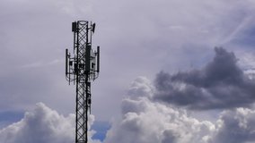 4K time lapse, Telecommunication towers with motion clouds on sky background. Video footage time lapse of tower signal in sky clouds moving background
