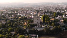 Aerial drone footage of the medieval castle of Kolossi, situated in the south of Cyprus, in Limassol and  village settlement from above. The castle dates back to the crusades and it is a landmark.