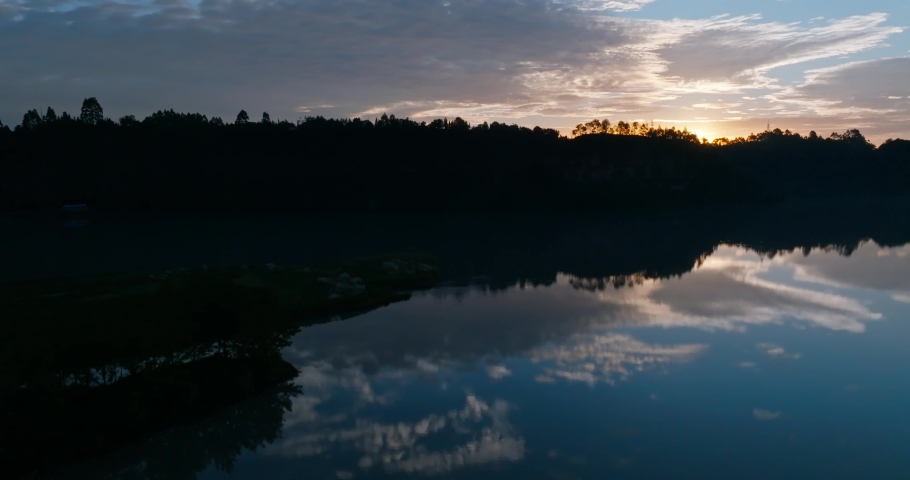 Aerial landscape of sunrise in the rural river hill clouds reflection in the water at Sichuan China