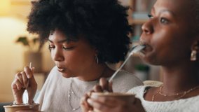 Relax, ice cream and lesbian couple eating together on the weekend to bond while watching tv. Young black people in romantic relationship enjoy sweet dessert break while resting in home. - Powered by Shutterstock - Get 15% off with code: PIKWIZARD15