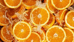 Super Slow Motion Shot of Splashing Fresh Oranges. Filmed on High Speed Cinematic Camera at 1000fps. - Powered by Shutterstock - Get 15% off with code: PIKWIZARD15
