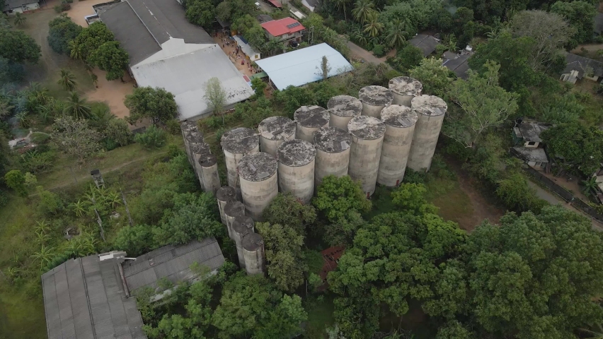 Noice aerial video of large and abandoned paddy storage buildings.