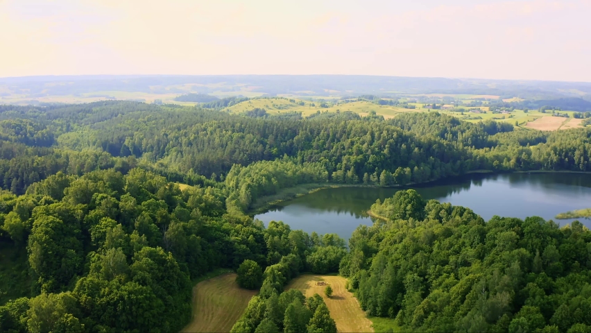 Aerial view of lake landscape in Poland under strong sunlight