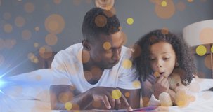 Animation of spots over african american father with daughter smiling. Family and digital interface concept digitally generated video.