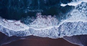 Aerial view nature video water wave texture on beach sand Beautiful surf sea water wave texture on beach Aerial view shot on drone camera top-down view Nature and travel concept 