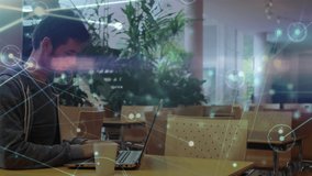 Animation of network of connections over caucasian male student using laptop. Global education, connections and digital interface concept digitally generated video. - Powered by Shutterstock - Get 15% off with code: PIKWIZARD15