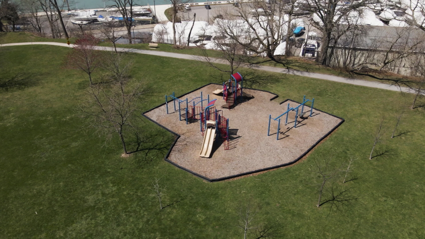 Aerial Orbital View of Empty Outside Playground Leisure Facilities Area for Kids in Westcliffe Park Ontario Canada, Urban Park and Recreation Swing Slide Games at Port Dalhousie Region, Spring Season