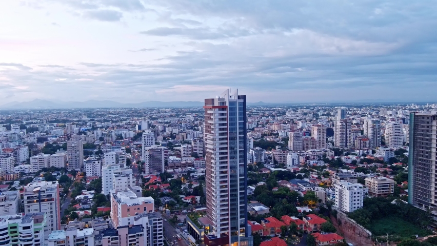 Evening South Point Tower in front of Mirador Sur Park. National District., Santo Domingo, Dominican Republic - aerial view
