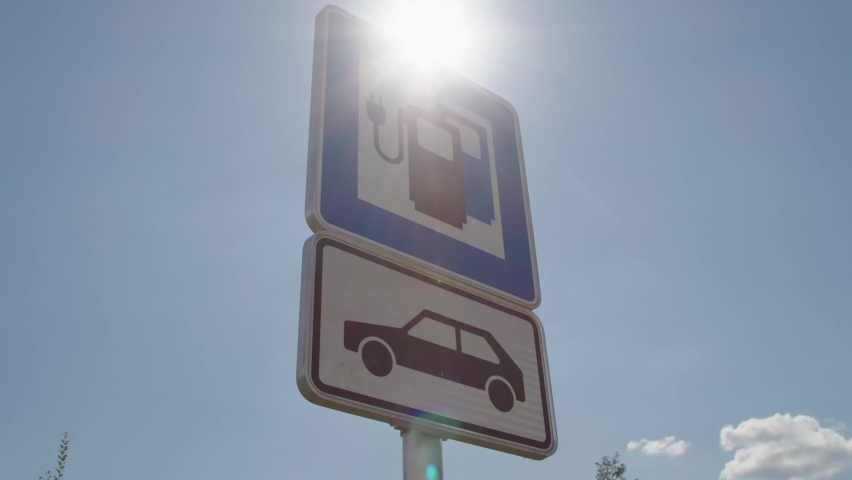 sign with electro charging station and sunlight