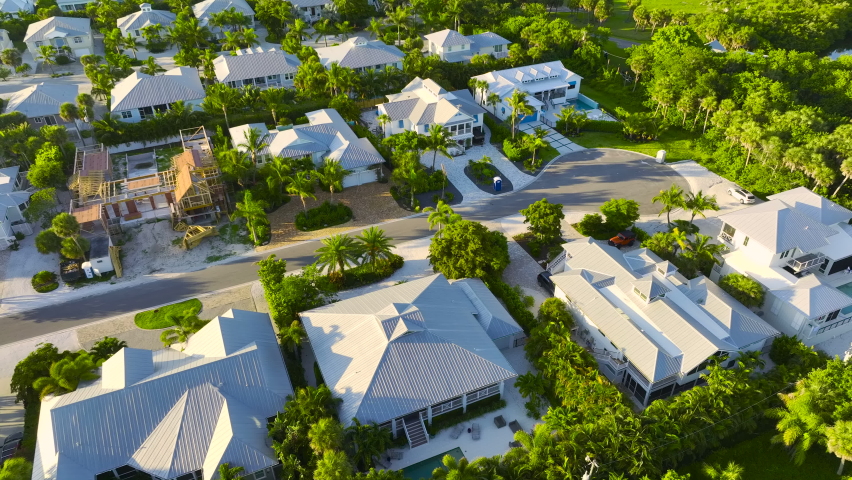 View from above of large residential houses in closed living golf club in south Florida. American dream homes as example of real estate development in US suburbs Royalty-Free Stock Footage #1094677443