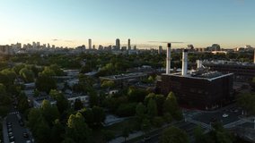 Aerial Drone Footage of the Charles River in Cambridge near Boston Massachusetts During Sunrise. Rowers and the city skyline visible on a beautiful summer morning. 