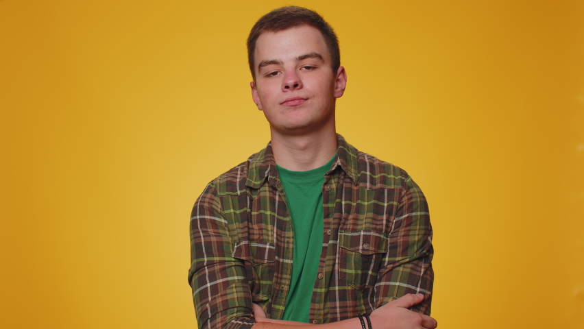 Upset tired, bored man in shirt making face palm gesture, feeling bored, disappointed in result of work, bad news. Young guy boy disappointed, helpless isolated alone on yellow studio wall background | Shutterstock HD Video #1094687439