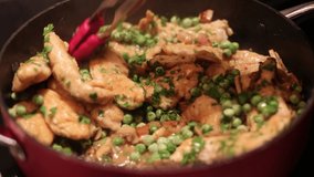 preparing chicken breast with mushrooms and pea close up