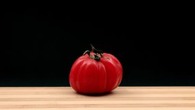 Whirling raf tomato is chopped. Stop motion animation.
