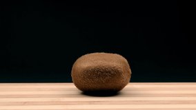 Whirling kiwi is chopped. Stop motion animation.