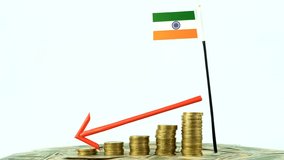 India flag with coins on turntable, inflation concept video, red down arrow, economy and finance idea, India decreasing values, country statistics, 4k 60 fps, economic crisis and downgrade - Powered by Shutterstock - Get 15% off with code: PIKWIZARD15