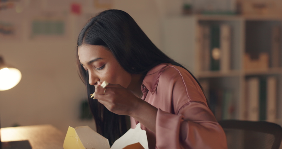 Woman at table in disgust by taste of food, from Asian restaurant or shop. Young lady unhappy with online meal order, from Japanese or Chinese store stop eating dinner after bite with chopsticks