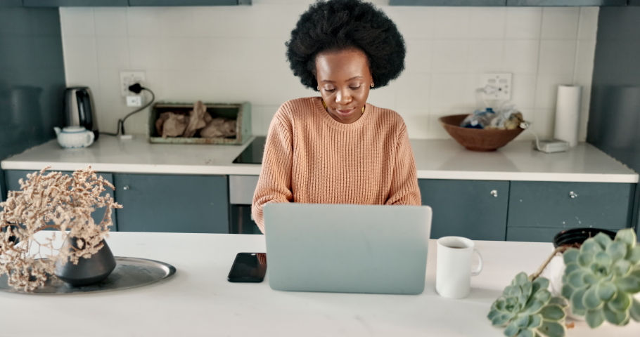 Phone call networking, laptop work and black woman planning on technology, communication on the web and talking on mobile in home kitchen. Remote African entrepreneur working on computer for internet | Shutterstock HD Video #1094697845