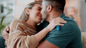Happy couple celebrate pregnancy test results in home lounge with love, hug and kissing. Young woman, smile man and surprise people excited for good news, fertility and pregnant announcement together - Powered by Shutterstock - Get 15% off with code: PIKWIZARD15