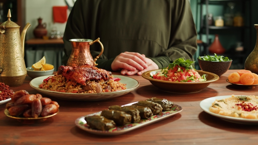 Kabsa, maqluba, dolma, tabbouleh close-up, rice and meat dish, middle eastern national traditional food. Muslim family dinner, Ramadan, iftar. Arabian cuisine. | Shutterstock HD Video #1094701819