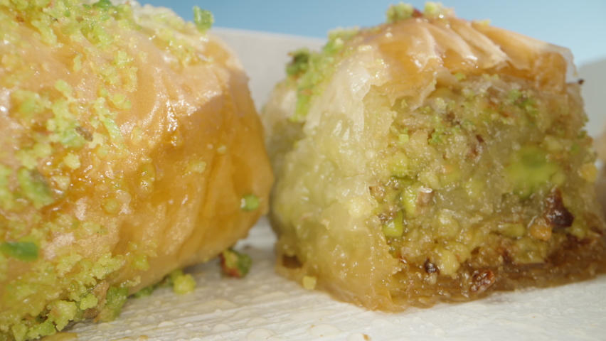 Turkish baklava with pistachios and walnuts. Dolly slider extreme close-up. | Shutterstock HD Video #1094703531