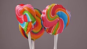 Colorful rainbow lollipop candy rotating colorful spiral of a Lollipop on a stick. Rotation video